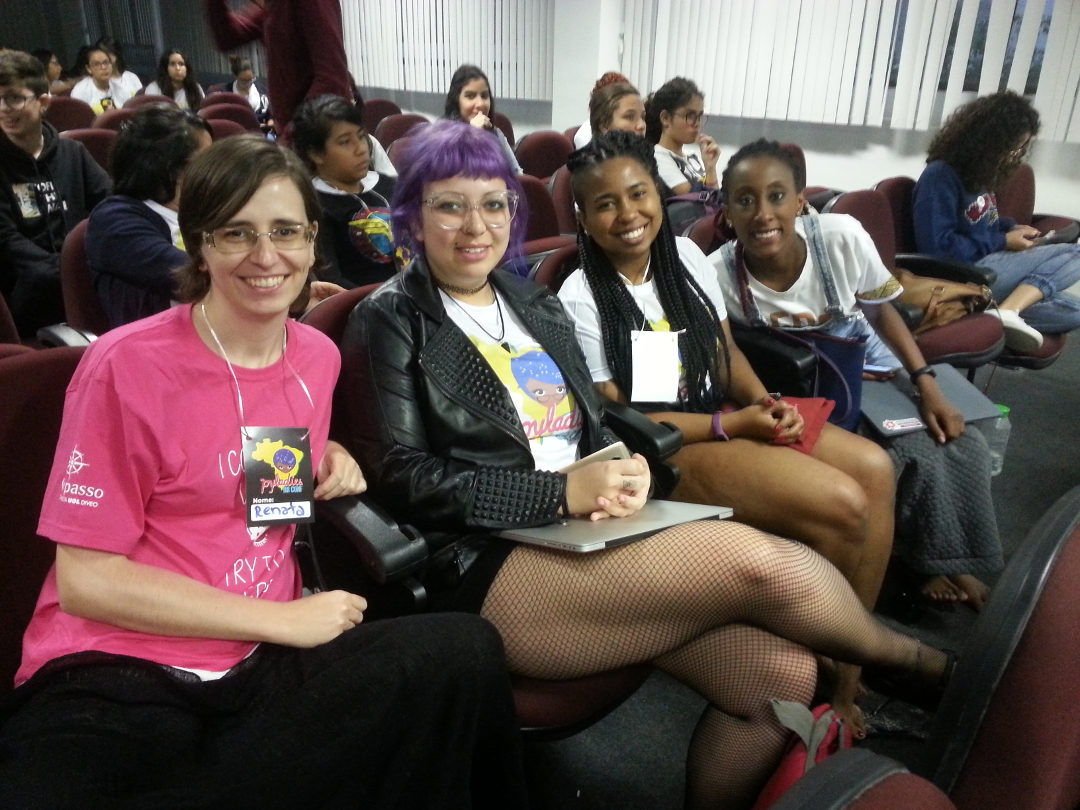 picture of PyLadies Porto Alegre at PyLadiesBRConf, four women sitting together in the audience